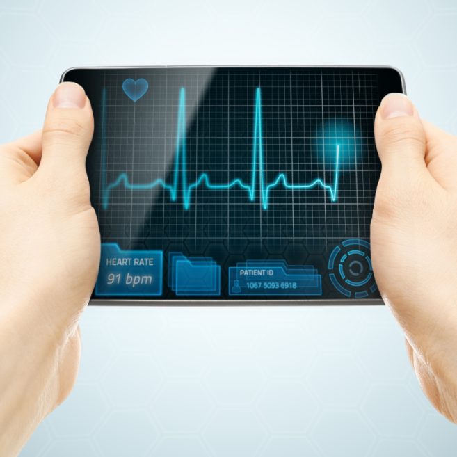 a digital tablet displaying a real-time heart rate monitor and ECG readout